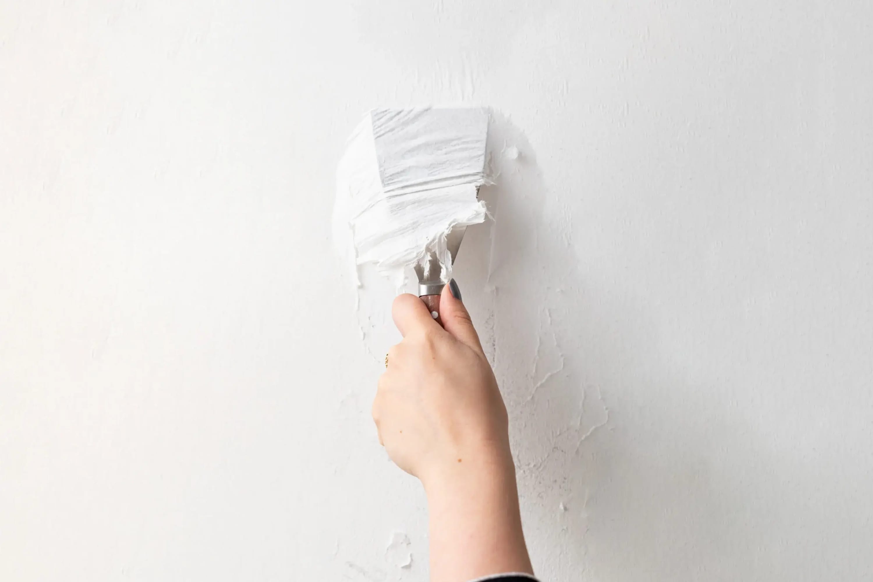 How to remove glue from walls